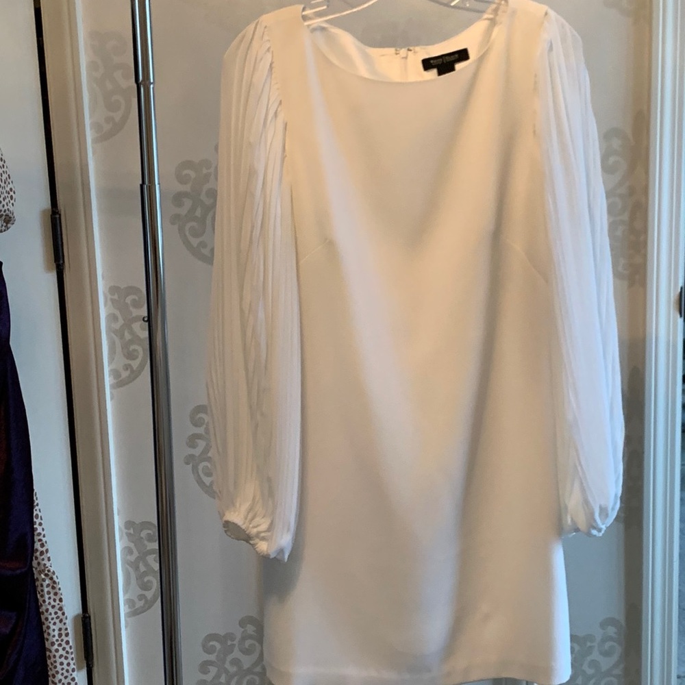 Elegant white dress with flowy sheer sleeves